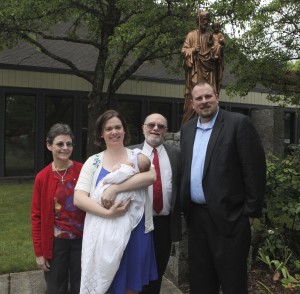 Abby with her godparents and parents